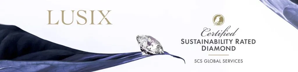 A polished diamond on blue fabric